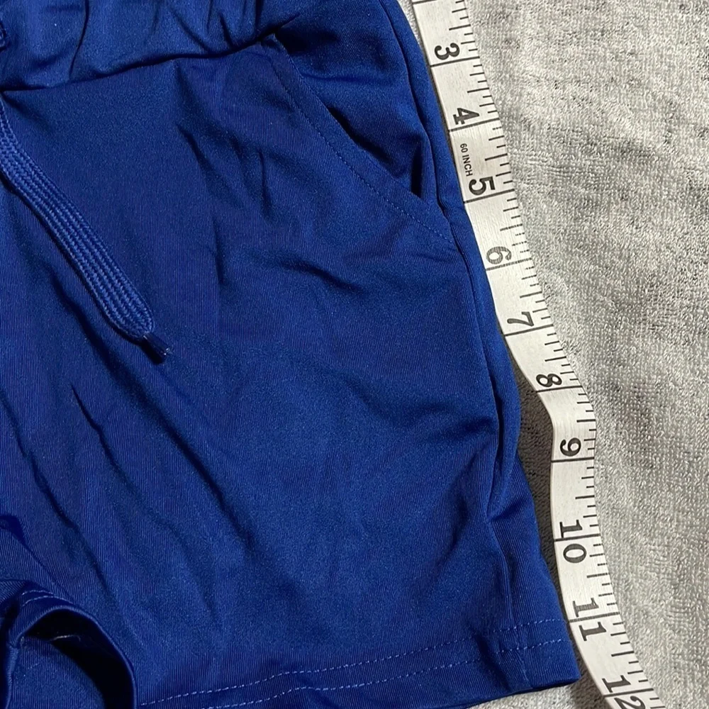 NWOT blue swim shorts M